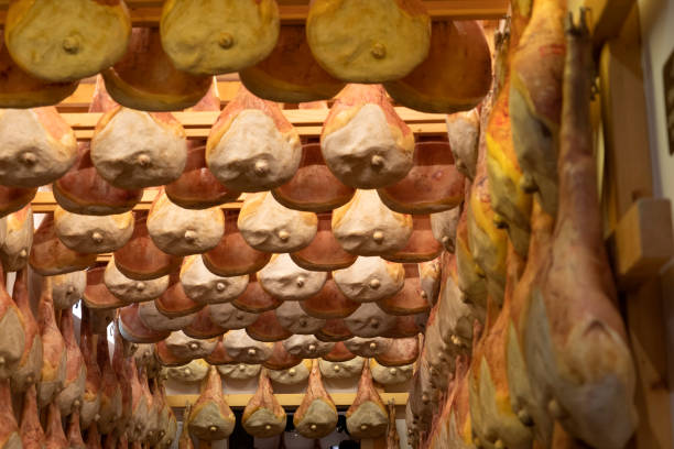 many San Daniele ham hanging for seasonig